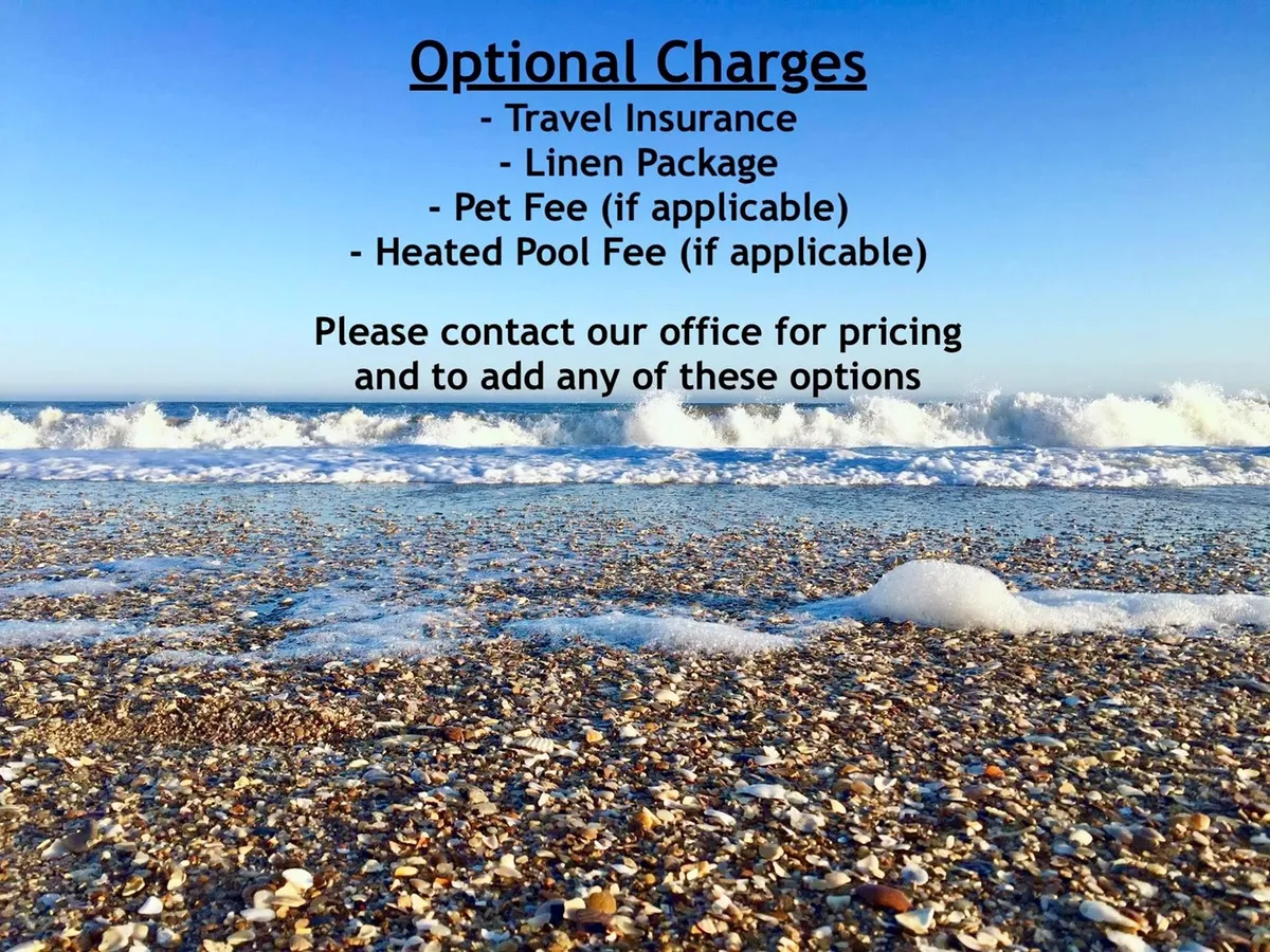 A scenic beachfront view of North Topsail Beach with gentle ocean waves rolling onto the sand, scattered seashells, and ample space for sunbathing or building sandcastles. The tranquil atmosphere is perfect for families looking to enjoy classic beach activities.